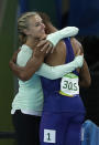 <p>United States’ Ashton Eaton, right, is congratulated by his wife Brianne Theisen Eaton of Canada after winning the gold medal in the decathlon during the athletics competitions of the 2016 Summer Olympics at the Olympic stadium in Rio de Janeiro, Brazil, Thursday, Aug. 18, 2016. (AP Photo/Matt Slocum) </p>