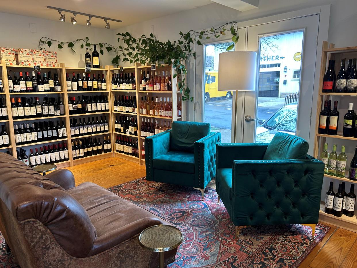 A sitting area inside Village Wine Company offers customers a place to relax. The shop, which opened in February, offers a different kind of shopping experience where customers can leave with wine tailored for them.