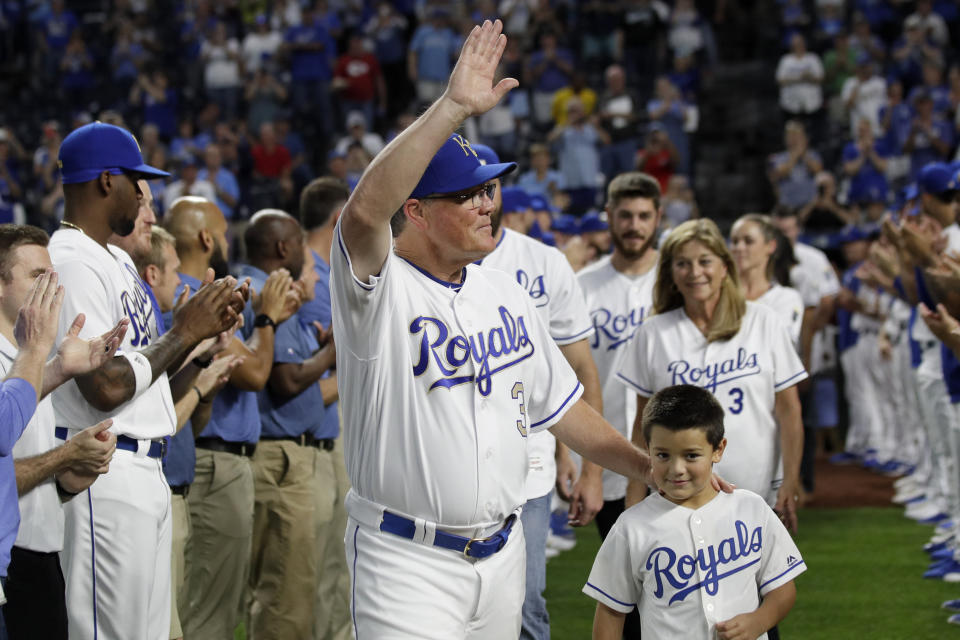 Kansas City Royals manager Ned Yost (3) waves to the crowd during a ceremony before a baseball game against the Minnesota Twins at Kauffman Stadium in Kansas City, Mo., Friday, Sept. 27, 2019. Yost will retire after Sunday's game. (AP Photo/Orlin Wagner)