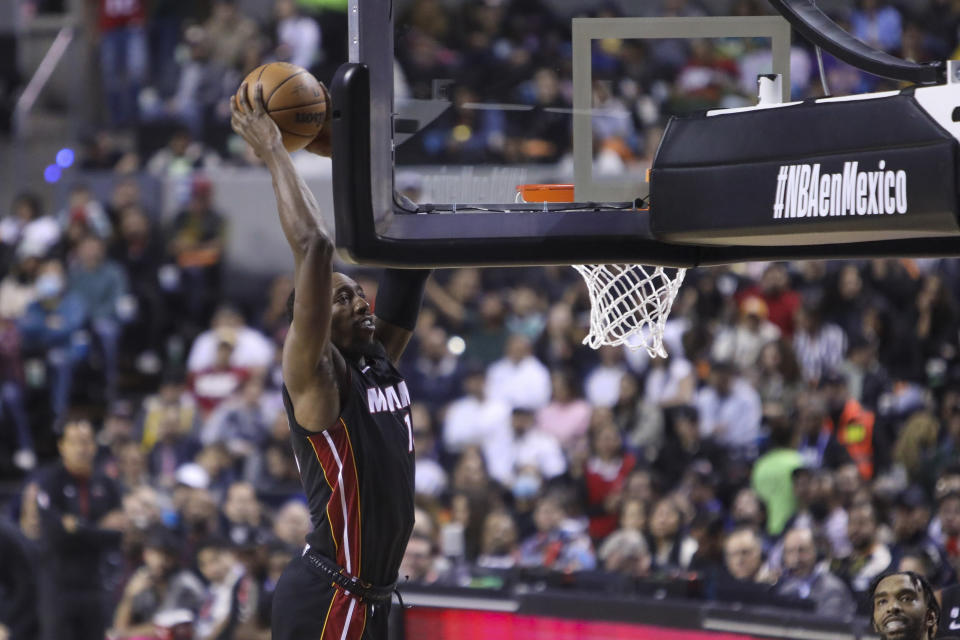 Miami Heat's Tyler Herro dunks the ball during the second half of an NBA basketball game against San Antonio Spurs, at the Mexico Arena in Mexico City, Saturday, Dec. 17, 2022. (AP Photo/Christian Palma)