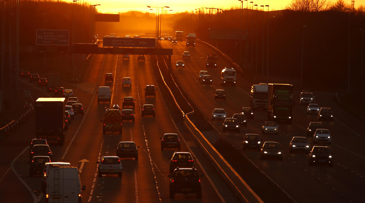 Traffic flows along the M56 motorway as the sun sets near Manchester, northern England February 15, 2016  REUTERS/Phil Noble    