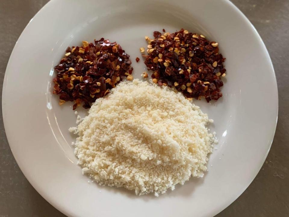 mickey-shaped crushed red pepper flakes and parmesan cheese at via napoli restaurant in epcot