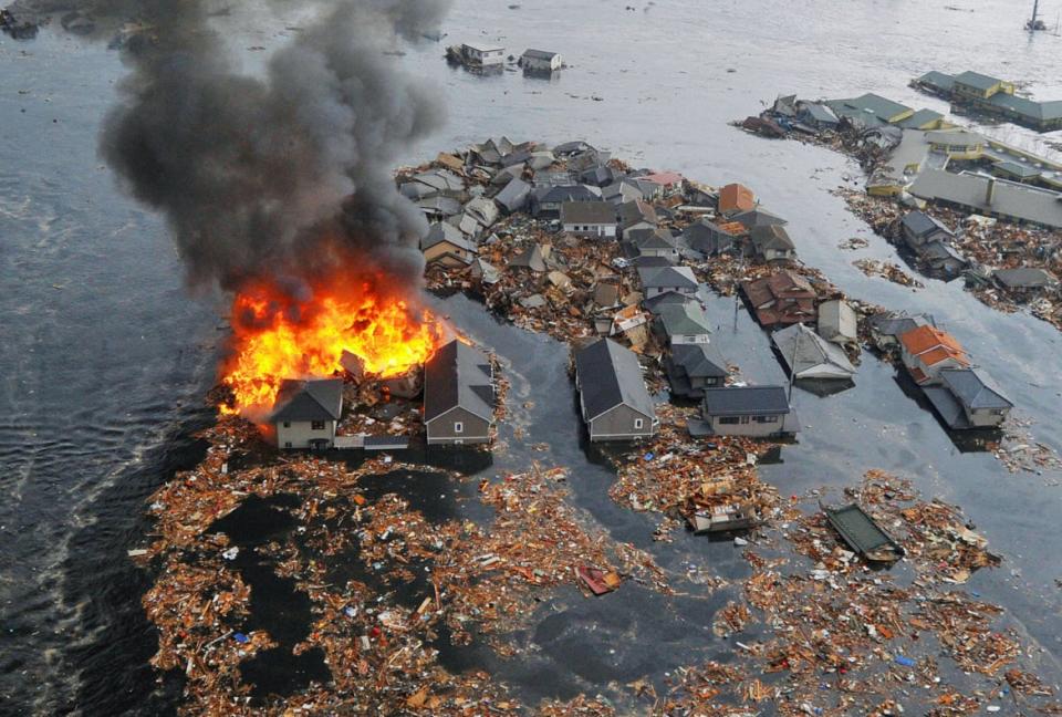 <div class="inline-image__caption"><p>Houses are swept by water following a tsunami and earthquake in Natori City in northeastern Japan March 11, 2011. A massive 8.9 magnitude quake hit northeast Japan on Friday, causing many injuries, fires and a ten-meter (33-ft) tsunami along parts of the country's coastline. </p></div> <div class="inline-image__credit">Kyodo/Reuters</div>