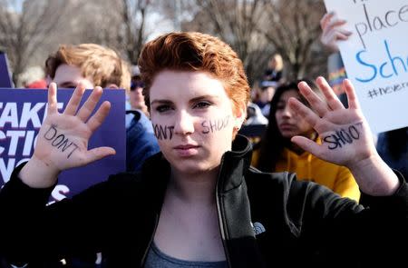 FILE PHOTO: Washington DC area students participate in a protest calling for stricter gun control as a part of the "Walkout Against Gun Violence" second annual event at the White House in Washington, U.S., March 14, 2019. REUTERS/Michael A. McCoy/Files