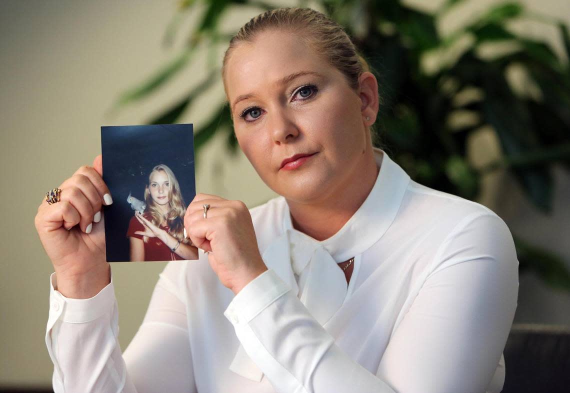 Virginia Roberts Giuffre, with a photo of herself as a teen, when she says she was abused by Jeffrey Epstein, Ghislaine Maxwell and Prince Andrew, among others.