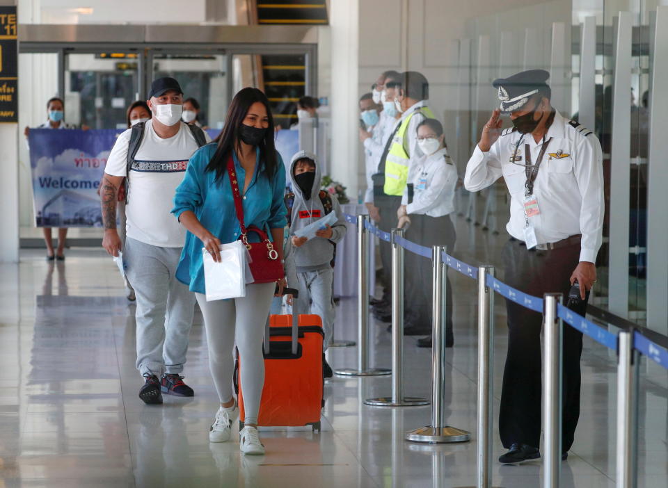 The first foreign tourists arrive at the airport as Phuket reopens to overseas tourists, allowing foreigners fully vaccinated against the coronavirus disease (COVID-19) to visit the resort island without quarantine, in Phuket, Thailand July 1, 2021. REUTERS/Jorge Silva