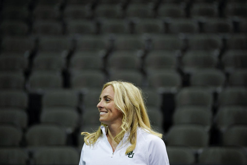 Baylor women's head coach Nicki Collen smiles as she listens to a reporter's question during the Big 12 NCAA college basketball media days Tuesday, Oct. 19, 2021, in Kansas City, Mo. (AP Photo/Ed Zurga)