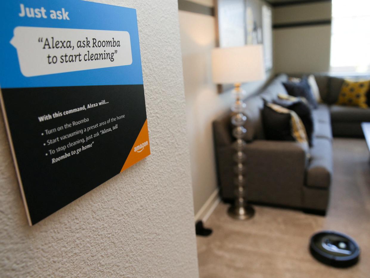 Prompts on how to use Amazon's Alexa personal assistant are seen as a wifi-equipped Roomba begins cleaning a room in an Amazon ‘experience center’ in Vallejo, California, U.S., May 8, 2018. Picture taken on May 8, 2018. REUTERS/Elijah Nouvelage/File Photo