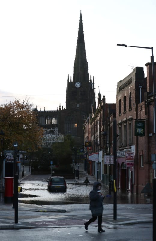 Car is pictured in floodwater in Rotherham, near Sheffield