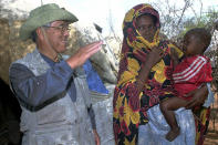 FILE - The leader of an eight-member Japanese delegation, Dr. Shoichiro Toyoda, left, visits Dadaab Refugee Camp in northern Kenya, Tuesday, Aug. 6, 1996. Shoichiro Toyoda, who as a son of the company's founder oversaw Toyota's expansion into international markets has died. He was 97. (AP Photo/Sayyid Azim)