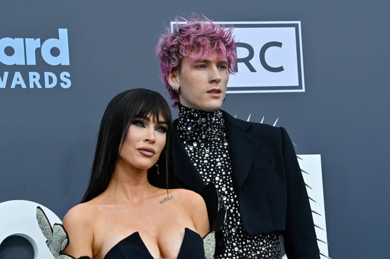 Machine Gun Kelly (R), pictured with Megan Fox, released the vulnerable new song "Don't Let Me Go." File Photo by Jim Ruymen/UPI