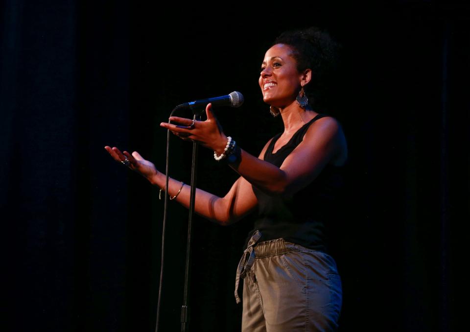 Akwi Nji shares her story of traveling to her childhood home in Cameroon during the Des Moines Register's Storytellers Project at Hoyt Sherman Place on Tuesday, June 14, 2022.