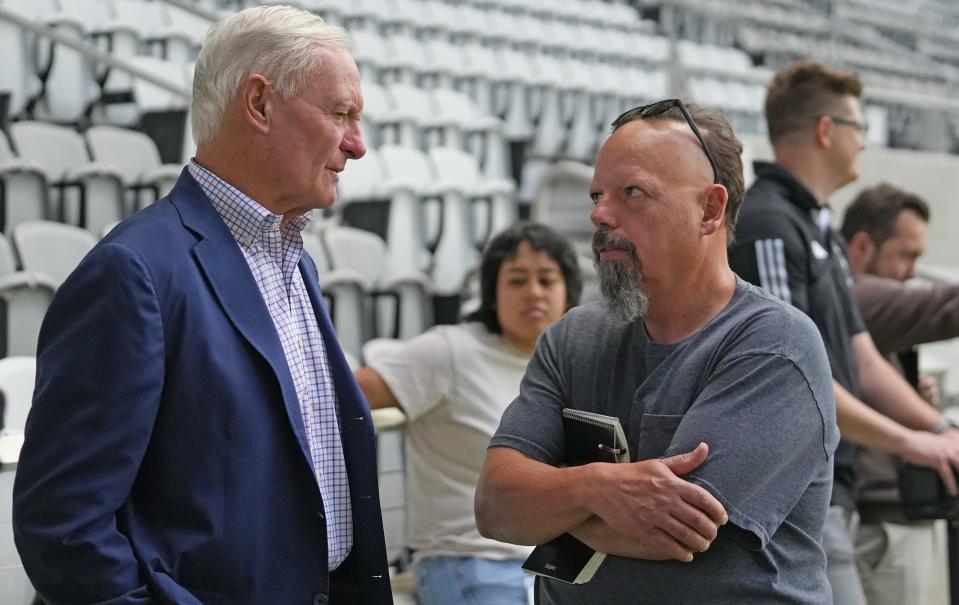 Columbus Crew co-owner Jimmy Haslam, left, talks with Columbus Dispatch columnist Mike Arace after a June 7 news conference announcing a new team general manager.