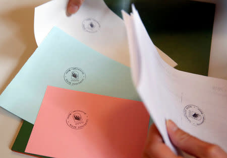 Stamped ballot papers are seen in a ballot office in a school during a vote on the nuclear exit, in Bern, Switzerland November 27, 2016. REUTERS/Ruben Sprich