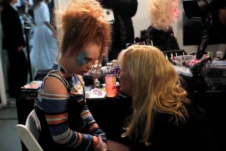 Australian model and designer Madeline Stuart, who has Down syndrome, speaks with her mother Roseanne backstage before presenting creations from her label 21 Reasons Why By Madeline Stuart during New York Fashion Week in Manhattan, New York, U.S., February 12, 2017. REUTERS/Andrew Kelly