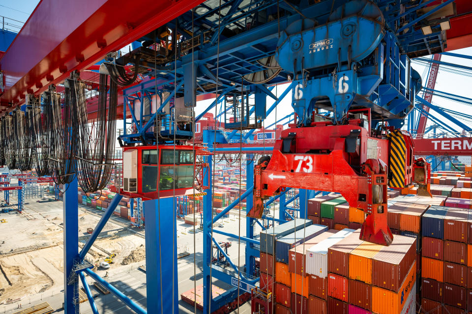 02 May 2024, Hamburg: Container gantry cranes at the Burchardkai terminal above the 