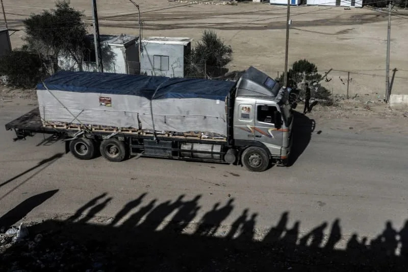 Trucks carrying humanitarian aid, fuel and gas enter the Gaza Strip through the Rafah crossing with Egypt, hours after the start of a four-day truce in fighting between Israel and Palestinian Hamas militants. Abed Rahim Khatib/dpa