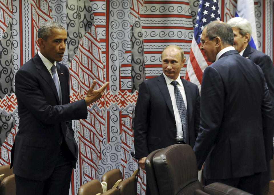 Russia's President Vladimir Putin (2nd L), Foreign Minister Sergei Lavrov (R, front), U.S. President Barack Obama (L) and U.S. Secretary of State John Kerry attend a meeting on the sidelines of the United Nations General Assembly in New York, September 28, 2015.