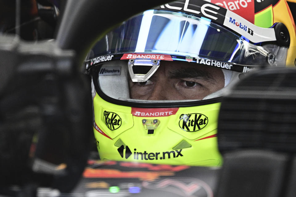 Red Bull driver Sergio Perez of Mexico sits in his car his car during the qualifying session ahead of Sunday's Formula One Italian Grand Prix auto race, at the Monza racetrack, in Monza, Italy, Saturday, Sept. 2, 2023. (Christian Bruna/Pool via AP)