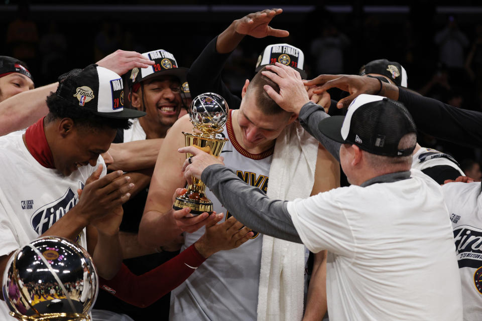 LOS ANGELES, CALIFORNIA - MAY 22: Nikola Jokic #15 of the Denver Nuggets celebrates with teammates after receiving the Most Valuable Player Trophy following game four of the Western Conference Finals against the Los Angeles Lakers at Crypto.com Arena on May 22, 2023 in Los Angeles, California. NOTE TO USER: User expressly acknowledges and agrees that, by downloading and or using this photograph, User is consenting to the terms and conditions of the Getty Images License Agreement. (Photo by Harry How/Getty Images)