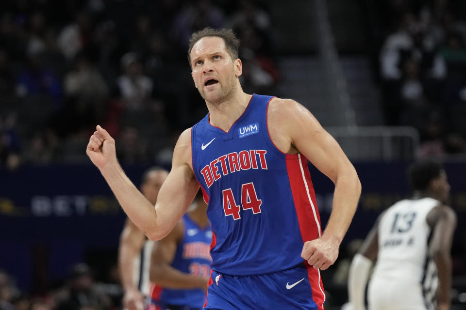 Detroit Pistons forward Bojan Bogdanovic (44) reacts after a three-point basket during the first half of an NBA basketball game against the Memphis Grizzlies, Wednesday, Dec. 6, 2023, in Detroit. (AP Photo/Carlos Osorio)