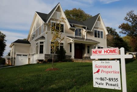 FILE PHOTO: A real estate sign advertising a new home for sale is pictured in Vienna, Virginia, U.S. October 20, 2014. REUTERS/Larry Downing/File Photo
