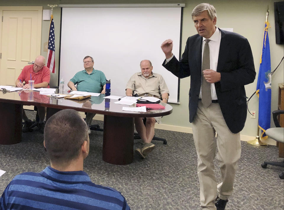 FILE - In this Monday, July 23, 2018 photo, Republican candidate for governor Bob Stefanowski speaks with members of the Ashford Republican Town Committee during a campaign stop in Ashford, Conn. Stefanowski touts his work at blue-chip companies like General Electric and UBS Investment Bank. Rivals criticized the most recent item on his resume: CEO of DFC Global company, which offers financial products that are not legal in Connecticut. Stefanowski counters that his experience straightening out the troubled company would serve him well fixing the state's stubborn budget deficits. (AP Photo/Susan Haigh)