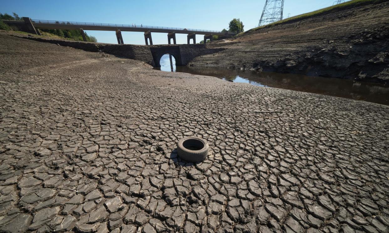 <span>Low water levels at Baitings Reservoir during a heatwave in August 2022.</span><span>Photograph: Christopher Furlong/Getty Images</span>