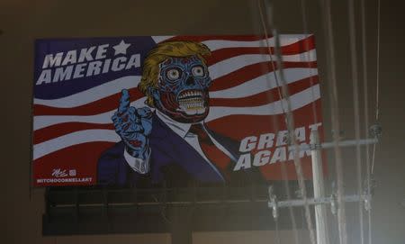 A giant billboard shows a drawing depicting U.S. President Donald Trump, along Periferico avenue in Mexico City, Mexico, July 27, 2017. Picture taken July 27, 2017. REUTERS/Henry Romero