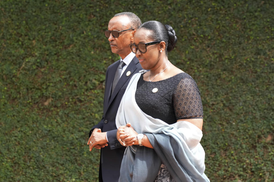 Rwandan President Paul Kagame, left, and his wife, first lady Jeannette Kagame arrive for a ceremony to mark the 30th anniversary of the Rwandan genocide, held at the Kigali Genocide Memorial, in Kigali, Rwanda, Sunday, April 7, 2024. Rwandans are commemorating 30 years since the genocide in which an estimated 800,000 people were killed by government-backed extremists, shattering this small east African country that continues to grapple with the horrific legacy of the massacres. (AP Photo/Brian Inganga)