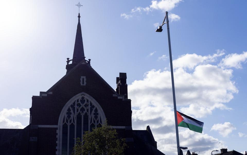 A Palestinian flag flies from a lamppost in Ilford