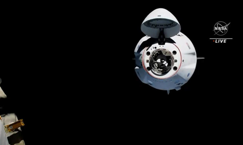 SpaceX's Crew-2 Crew Dragon Endeavour arrives at the International Space Station with four astronauts aboard in a smooth docking on April 24, 2021 one day after launching into orbit.