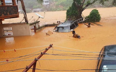flooded streets in Regent - Credit: Society for Climate Change Communication Sierra Leone/AFP