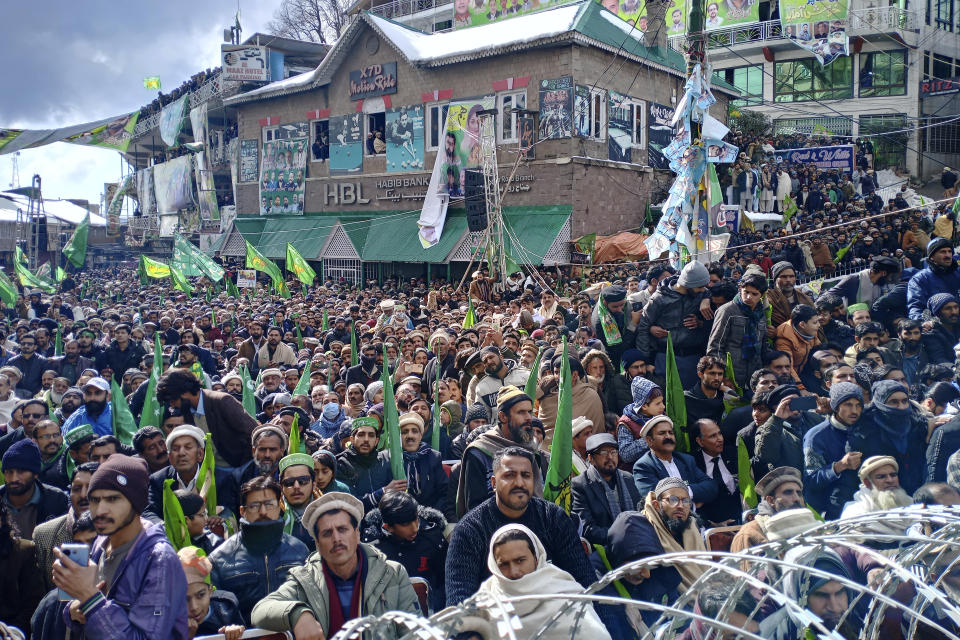 Supporters of Pakistan's former Prime Minister Nawaz Sharif listen to the speech of their leader during an election campaign rally in Murree, Pakistan, Monday, Feb. 5, 2024. (AP Photo/Muhammad Yousuf)