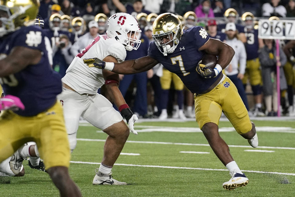 Notre Dame running back Audric Estime, right, runs for a touchdown against Stanford during the second half of an NCAA college football game in South Bend, Ind., Saturday, Oct. 15, 2022. Stanford won 16-14. (AP Photo/Nam Y. Huh)