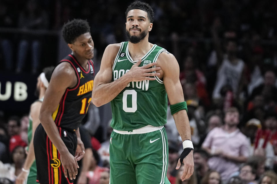 Boston Celtics forward Jayson Tatum (0) celebrates after scoring against the Atlanta Hawks, during the second half of Game 4 of a first-round NBA basketball playoff series, Sunday, April 23, 2023, in Atlanta. (AP Photo/Brynn Anderson)