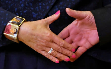 FILE PHOTO: British Prime Minister Theresa May and European Commission President Jean-Claude Juncker shake hands at EC headquarters before a meeting to discuss draft agreements on Brexit, in Brussels, Belgium November 24, 2018. REUTERS/Dylan Martinez/File Photo