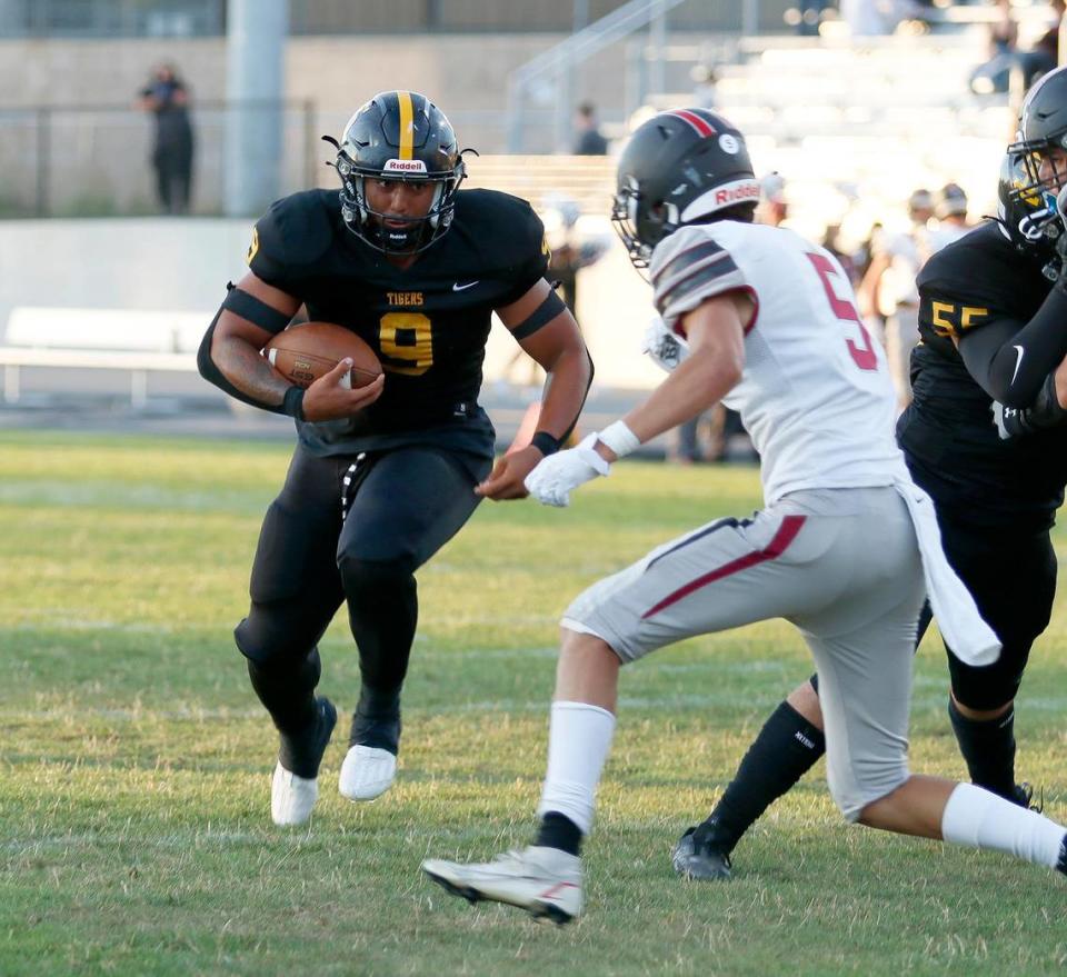 Tigers ball carrier Isaiah Hernandez faces off with Nipomo’s Juan Zarate (5). San Luis Obispo beat Nipomo 38-7 in a nonleague game at San Luis Obispo High School’s Holt Field stadium, Aug. 18, 2023.