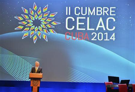 Cuba's president Raul Castro addresses the audience during the the opening ceremony of the Community of Latin American and Caribbean States (CELAC) summit in Havana January 28, 2014. REUTERS/Adalberto Roque/Pool