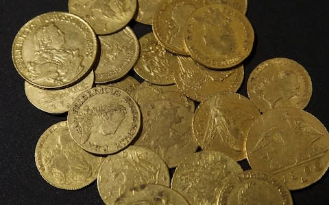 Antique gold coins sit on display - Credit: Alex Kraus/Bloomberg