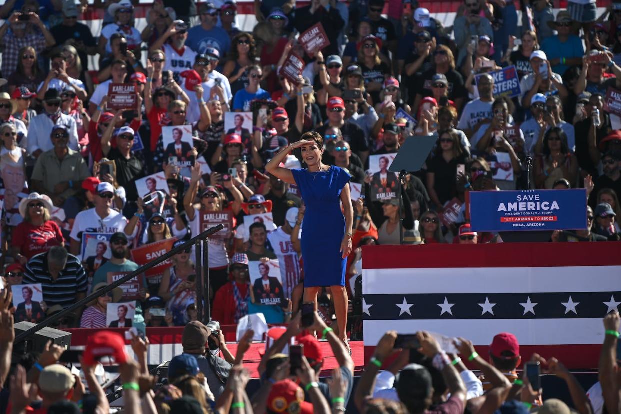 Kari Lake, the GOP candidate for Arizona governor, campaigns at a rally on Oct. 9, 2022. <a href="https://media.gettyimages.com/photos/republican-candidate-for-arizona-governor-kari-lake-acknowledges-the-picture-id1244007617?s=612x612" rel="nofollow noopener" target="_blank" data-ylk="slk:Joshua Lott/The Washington Post via Getty Images;elm:context_link;itc:0" class="link ">Joshua Lott/The Washington Post via Getty Images </a>
