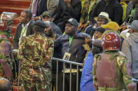 Police are deployed to provide security after scuffles broke out between political party agents and police at the electoral commission's national tallying center in Nairobi, Kenya late night Saturday, Aug. 13, 2022. Kenya's peaceful presidential election saw a brief disruption late Saturday when police responded to scuffles at the national tallying center amid tensions over the close results. (AP Photo)