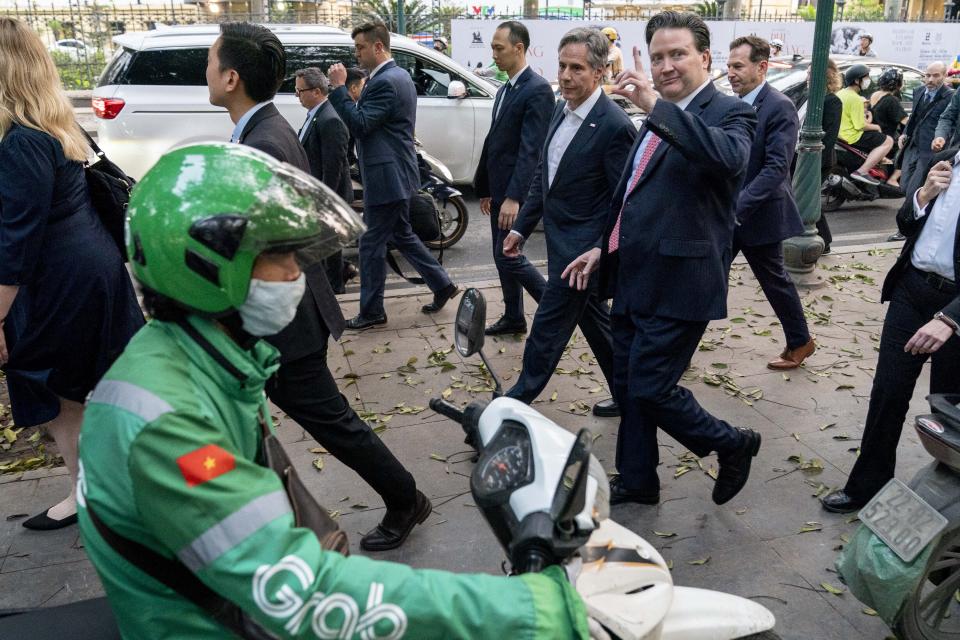 U.S. Secretary of State Antony Blinken, accompanied by Ambassador of the United States to Vietnam Marc Knapper, right, walks to Binh Minh Jazz Club in Hanoi, Vietnam, Saturday, April 15, 2023. (AP Photo/Andrew Harnik, Pool)