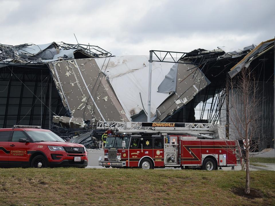 First responders surround a damaged Amazon Distribution Center on December 11, 2021 in Edwardsville, Illinois (Getty Images)