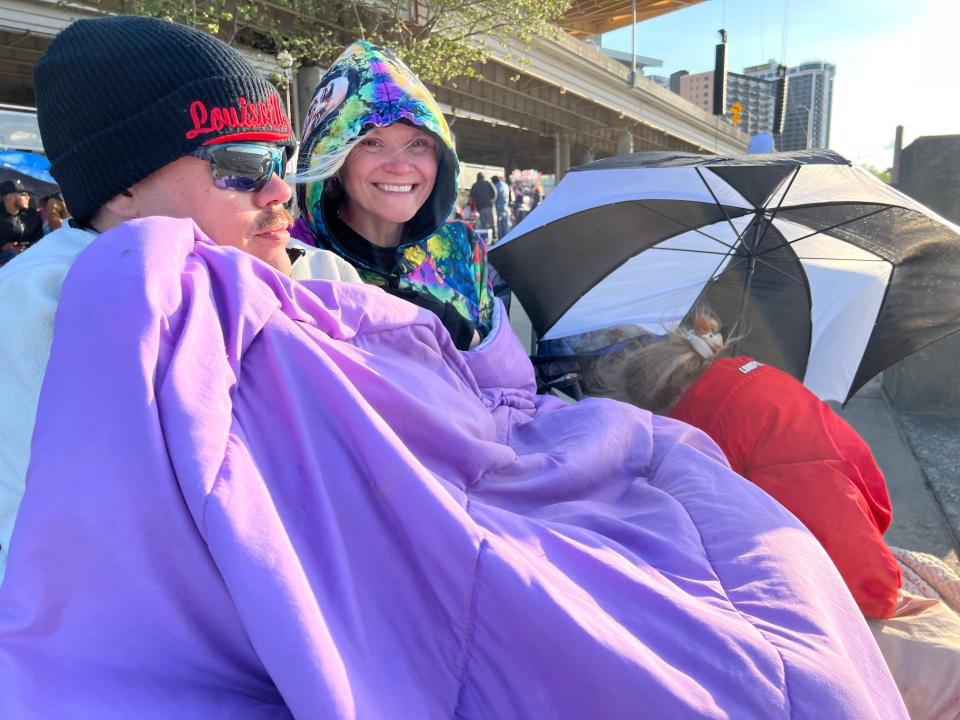 Brian, Amanda and Briana May love Thunder Over Louisville airshow and fireworks — no matter the weather. They had a front row seat with the river too. So they had no wind blockage