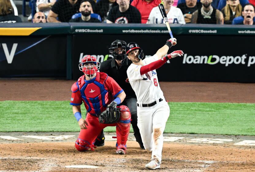 MIAMI, FLORIDA - MARCH 19: Trea Turner #8 of Team USA hits a three run homerun.