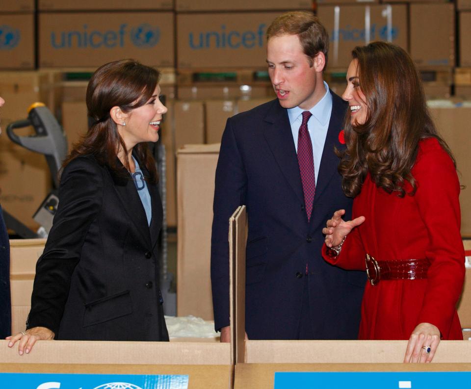 Princess Mary of Denmark, Prince William, and Kate Middleton help to pack relief boxes as they visit the UNICEF emergency supply centre on November 2, 2011 in Copenhagen, Denmark.