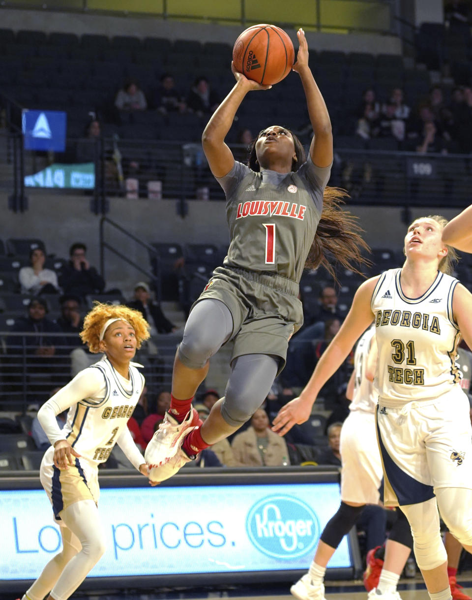 Louisville forward Ramani Parker(1) shoots for a basket past Georgia Tech defenders Jasmine Carson (2) and Lotta Maj-Lahtinen (31) during the first half of an NCAA college basketball game Thursday, Feb. 20, 2020, in Atlanta, Ga(AP Photo/Tami Chappell)