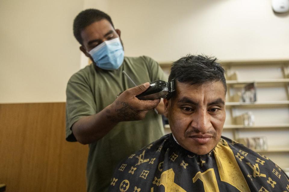 Alex Perez gets a haircut.