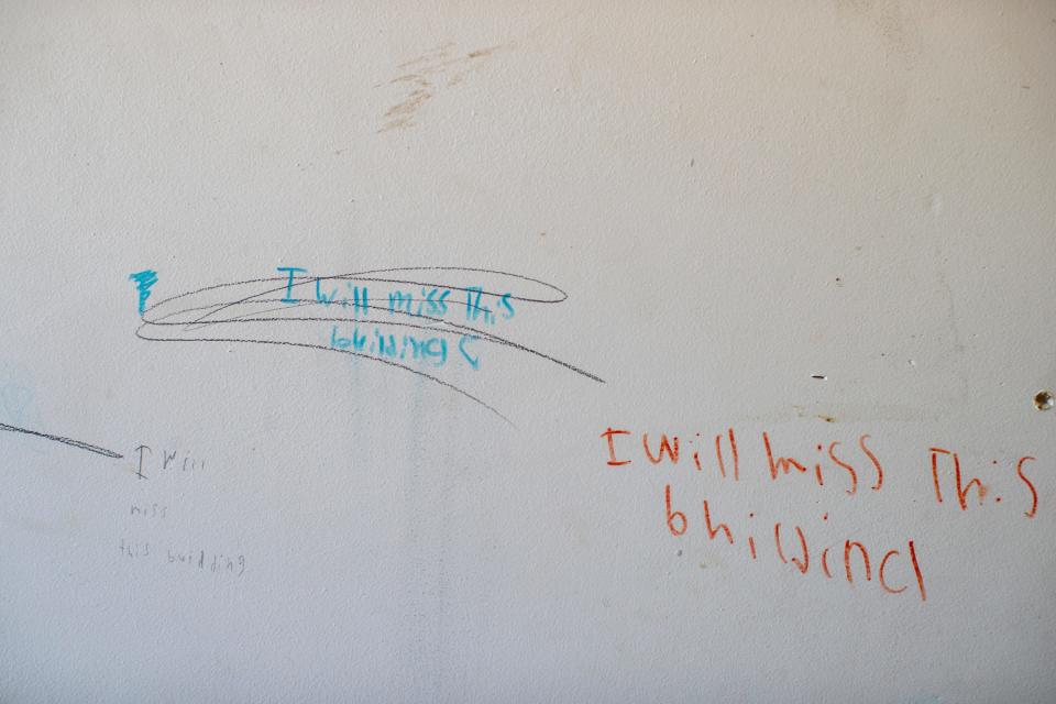 The handwritten words, "I will miss this building," can be seen on the wall inside an unpermitted housing complex that will shut down, displacing hundreds in San Bernardino, Calif., on October 5, 2022. 